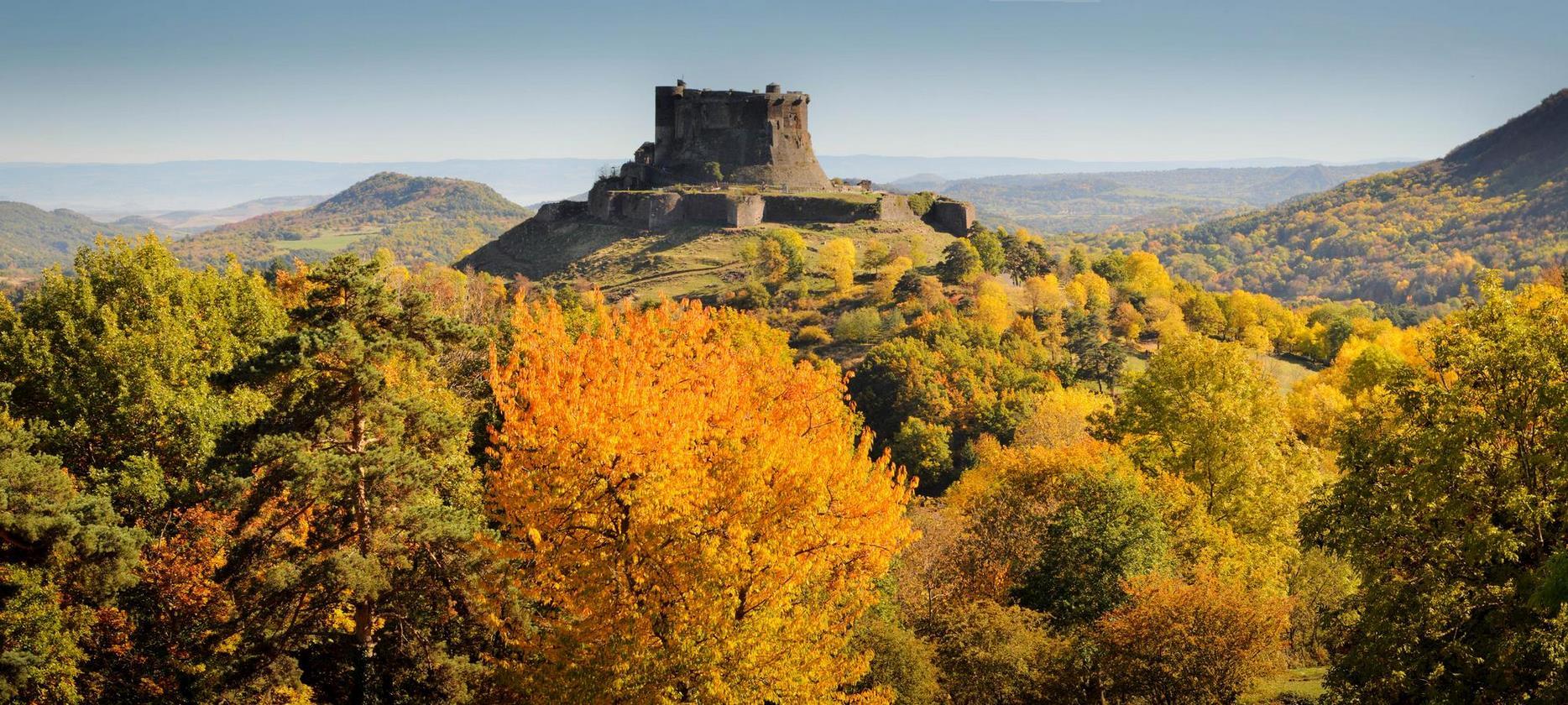 Chateau de Murol in Autumn with a view of the Auvergne volcanoes