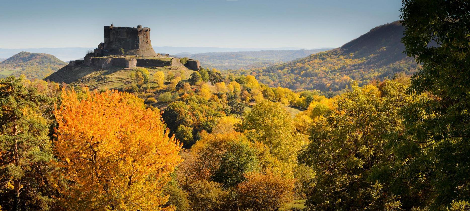 The Chateau de Murol overlooking the Murol valley in Autumn