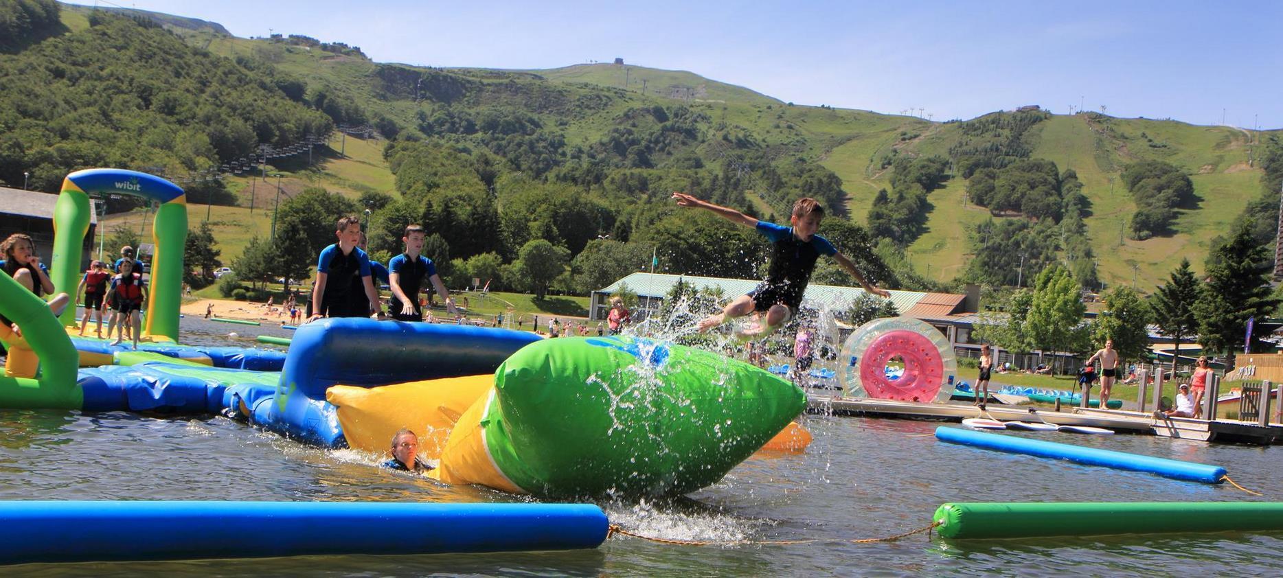 Inflatable games on the Lac des Hermines in Super Besse