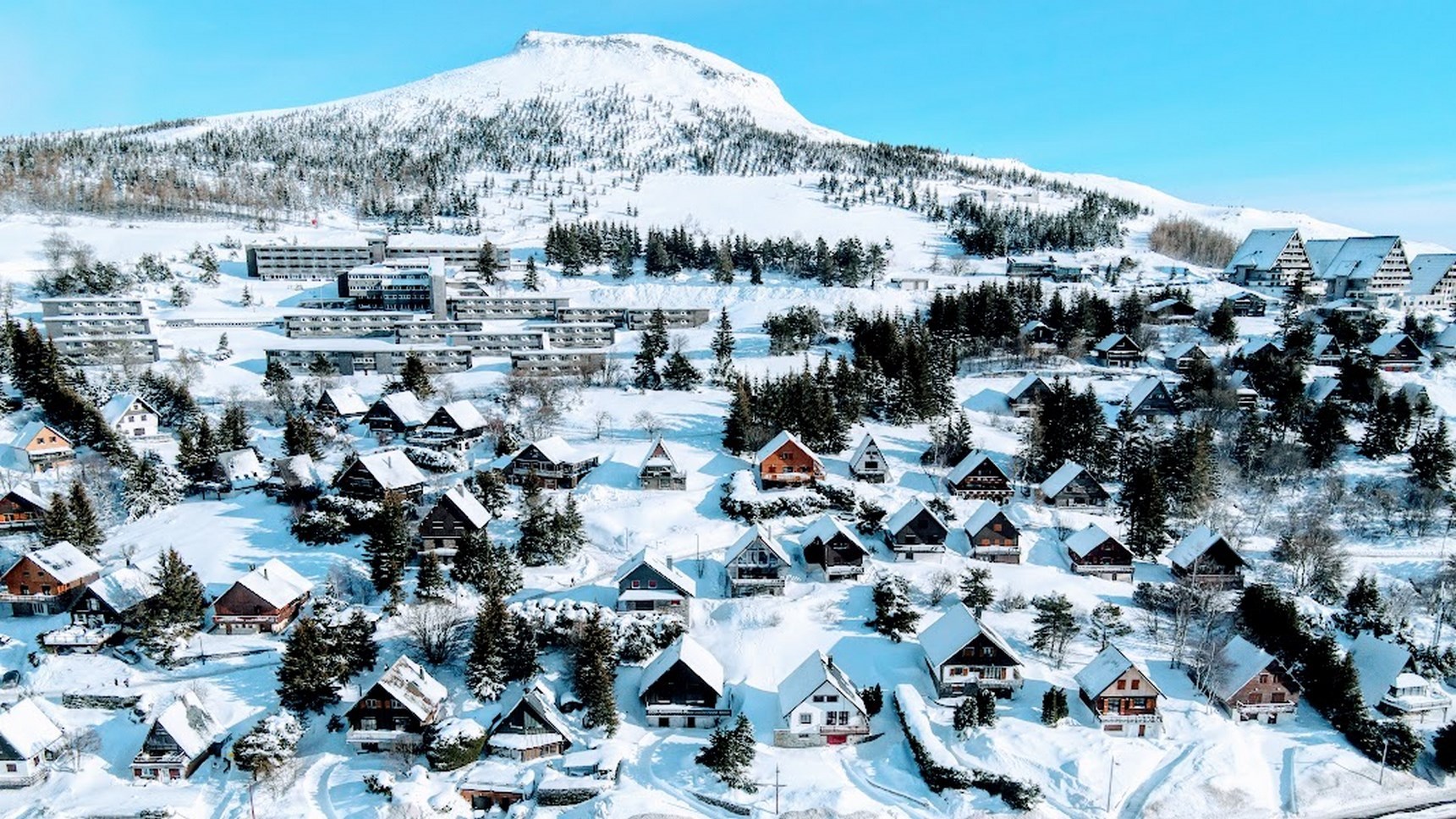 Wide panorama of the chalet village of the resort of Super Besse during the summer season