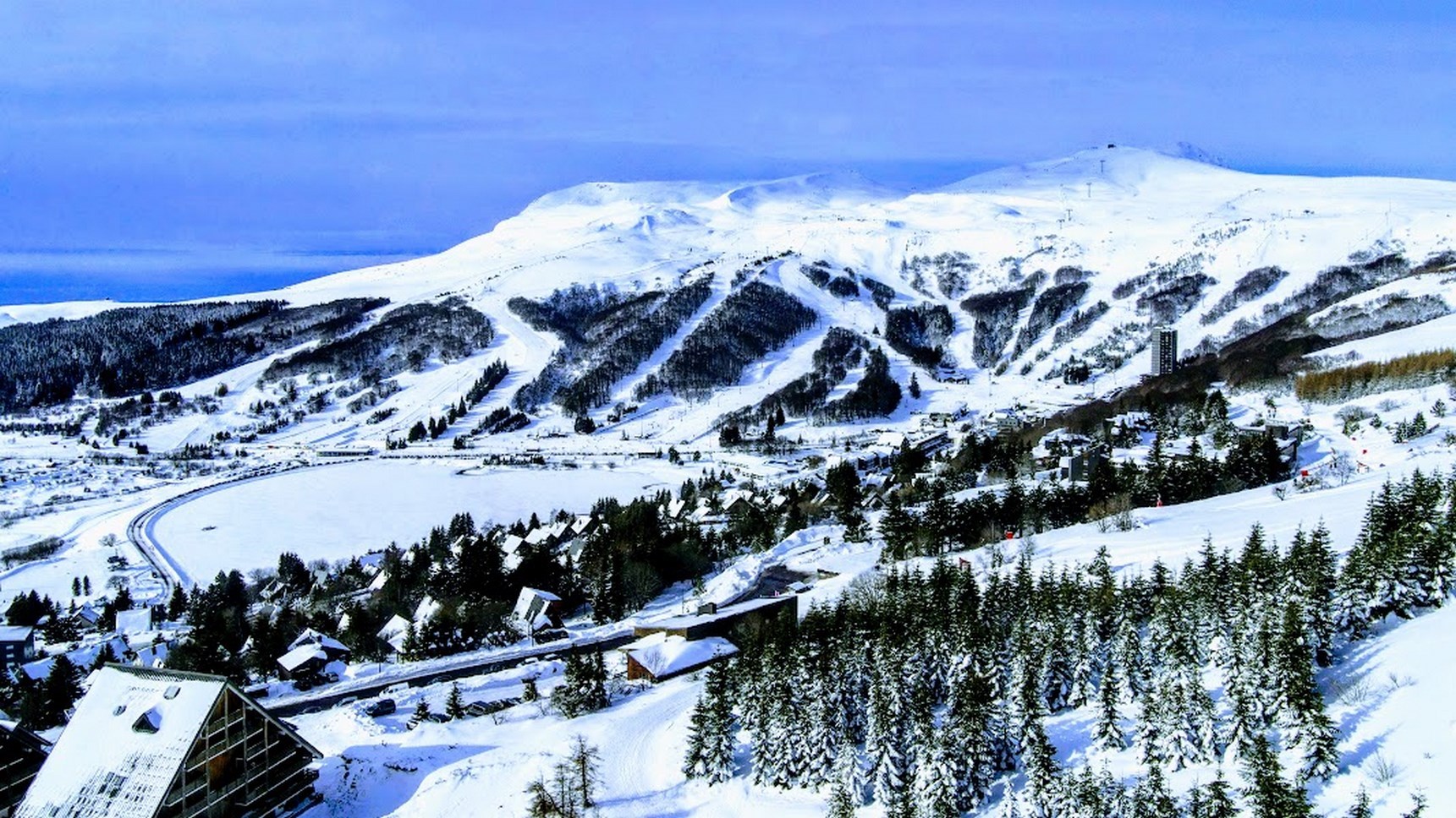 Wide panorama on the ski resort of Super Besse seen to the east of Super Besse