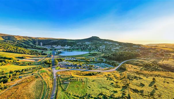 Super Besse at sunrise, view of Lac des Hermines and the resort of Super Besse