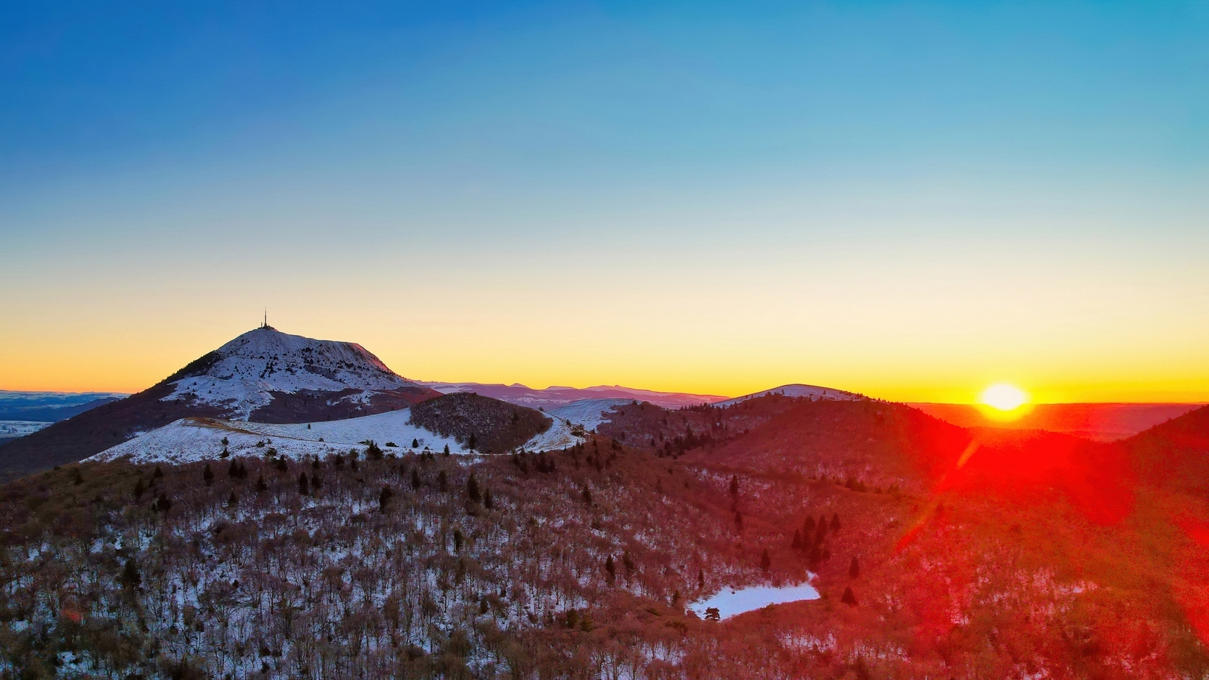 Sunset over the snow-capped Puy de Dome