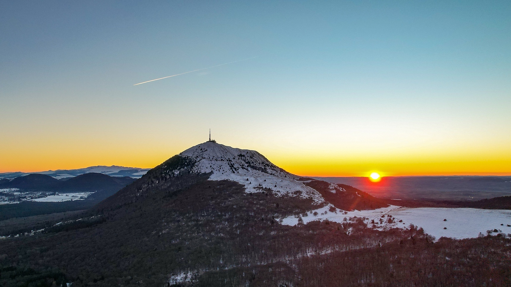 Sunset over the snow-capped Puy de Dome
