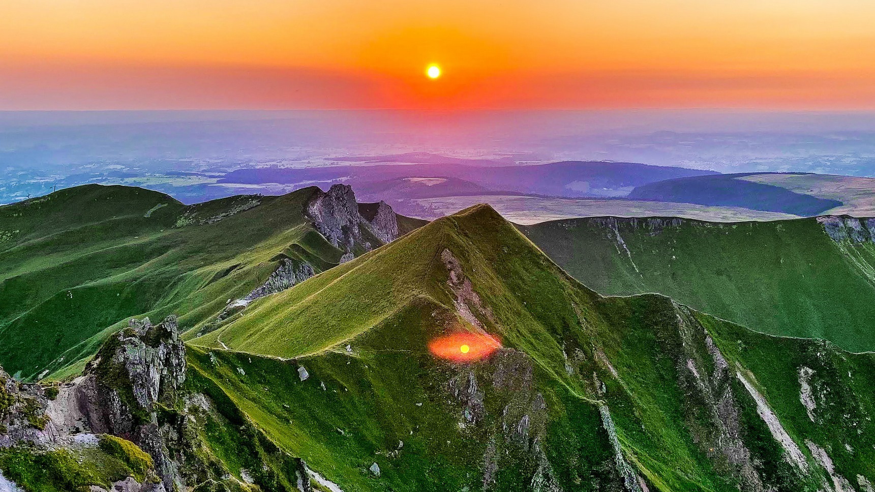 At the top of Puy de Sancy, summer sunset