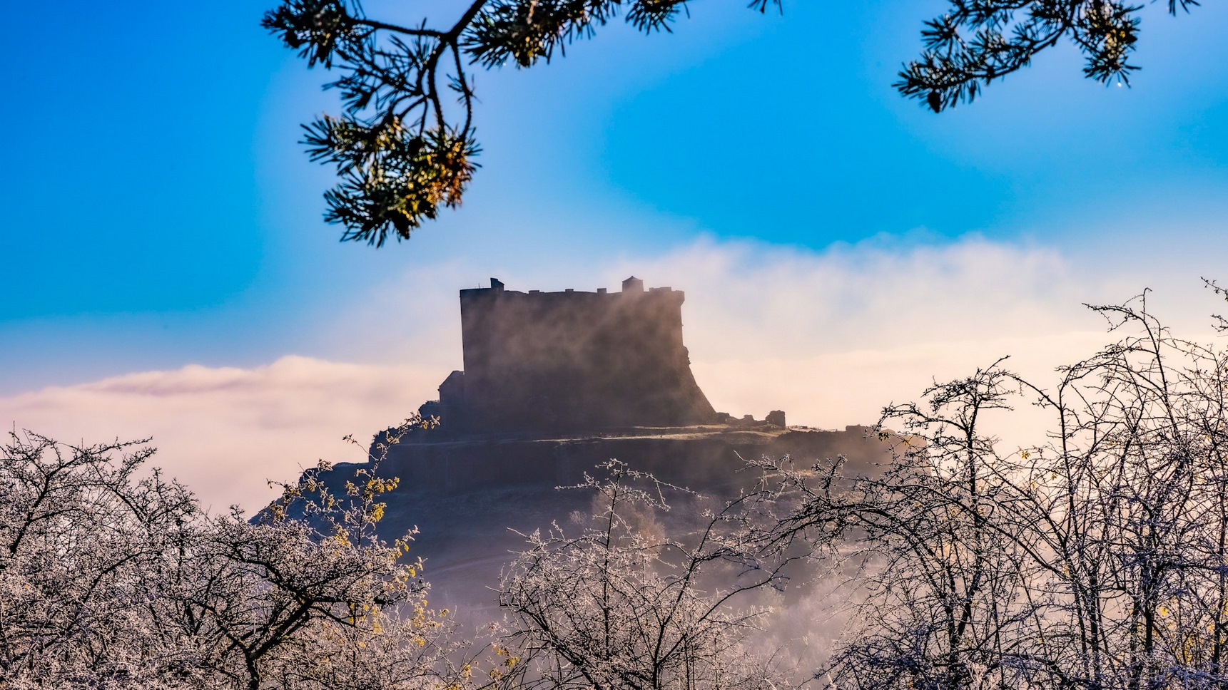 Massif du Sancy, the castle of Murol in the clouds
