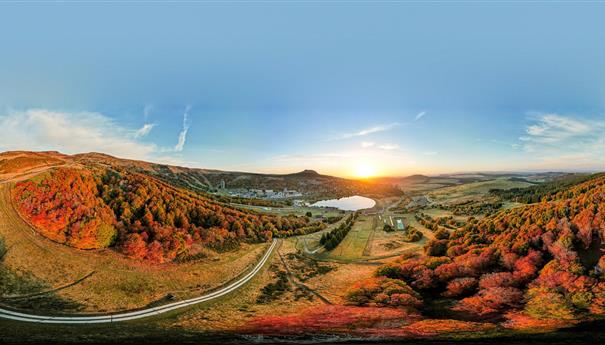 Super Besse, unique colors of the trees of the resort of Super Besse at sunrise in September - October