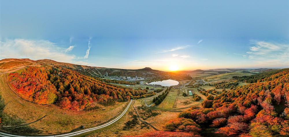 Super Besse, unique colors of the trees of the resort of Super Besse at sunrise in September - October
