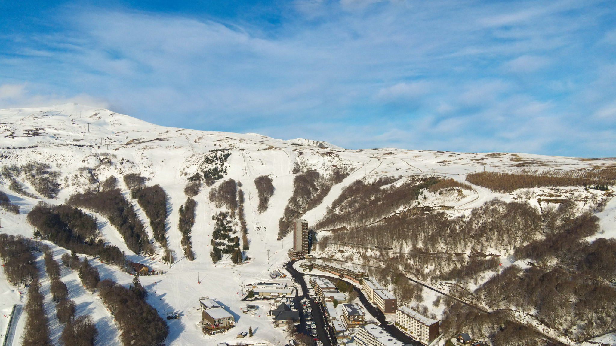 Super Besse seen from the sky, the Perdrix cable car and the town center of Super Besse