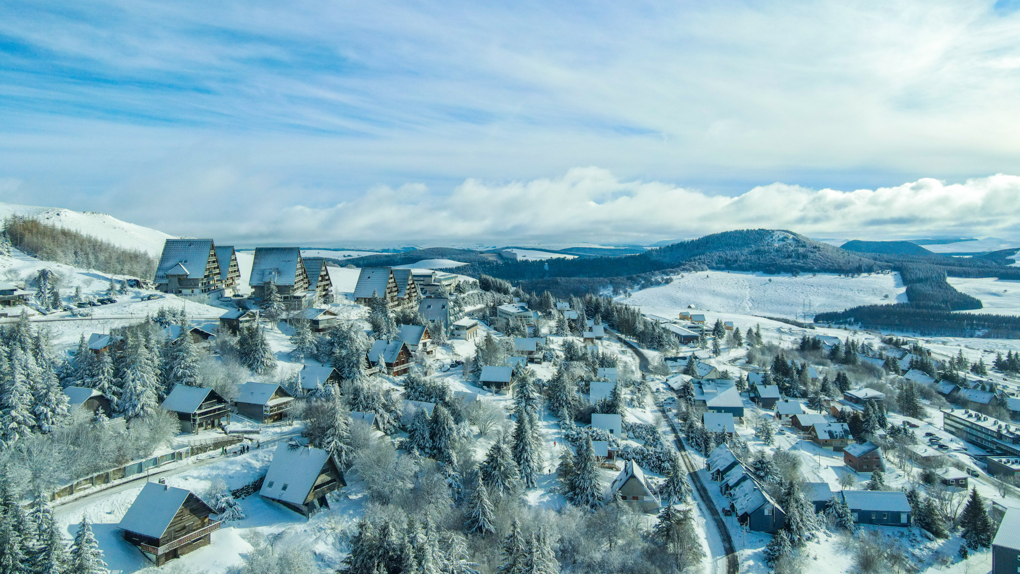 Super Besse seen from the sky, the village of Chalets and the residences under the snow