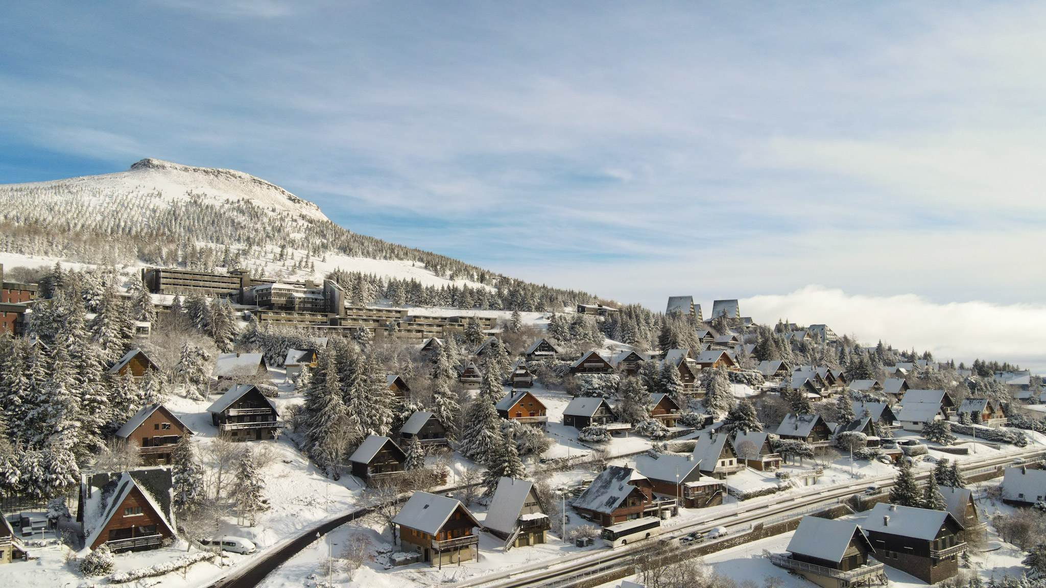 Super Besse seen from the sky, the VVF Holiday Village and the Puy du Chambourguet under the snow