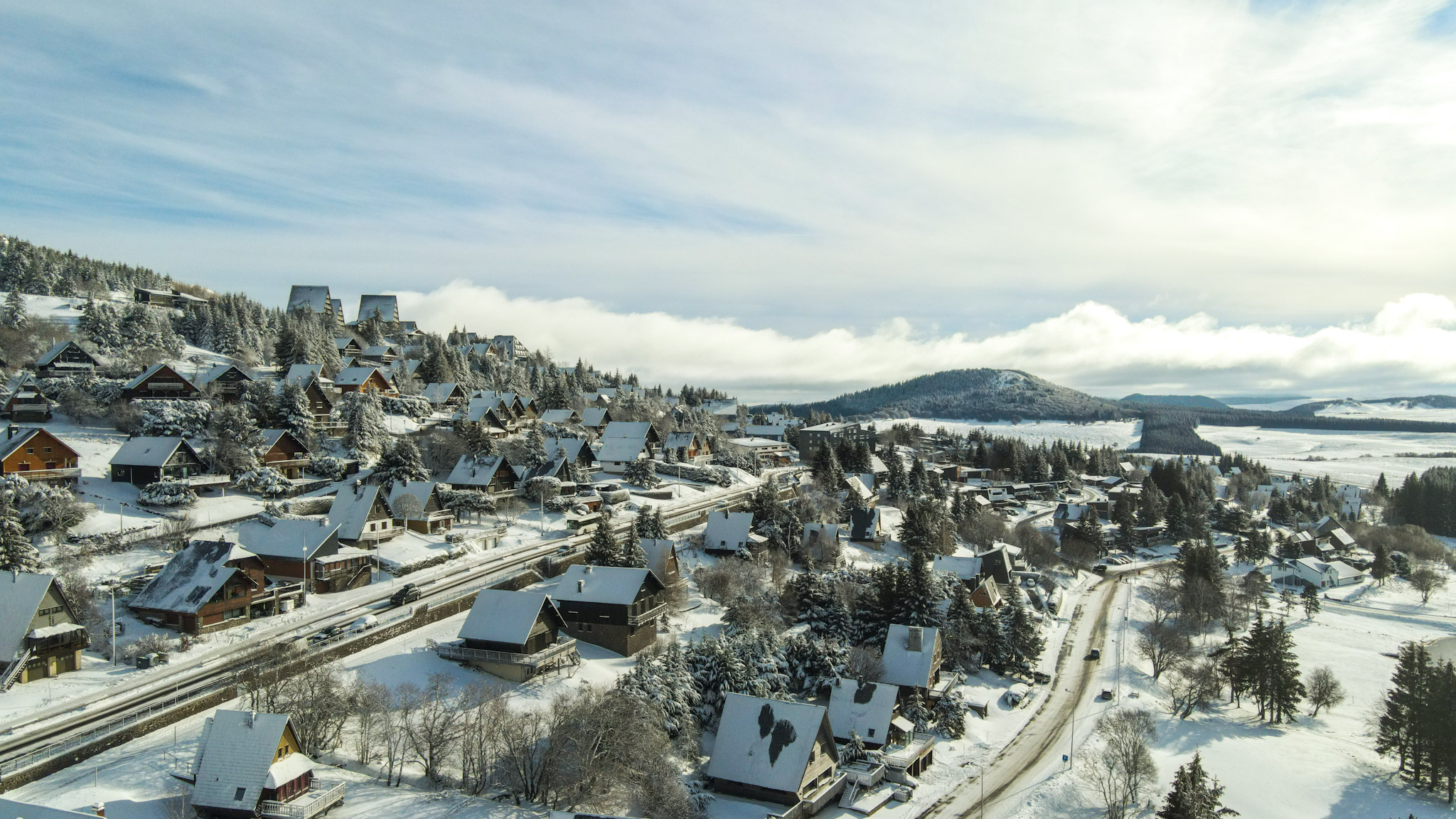 Super Besse seen from the sky, the village of chalets under the snow