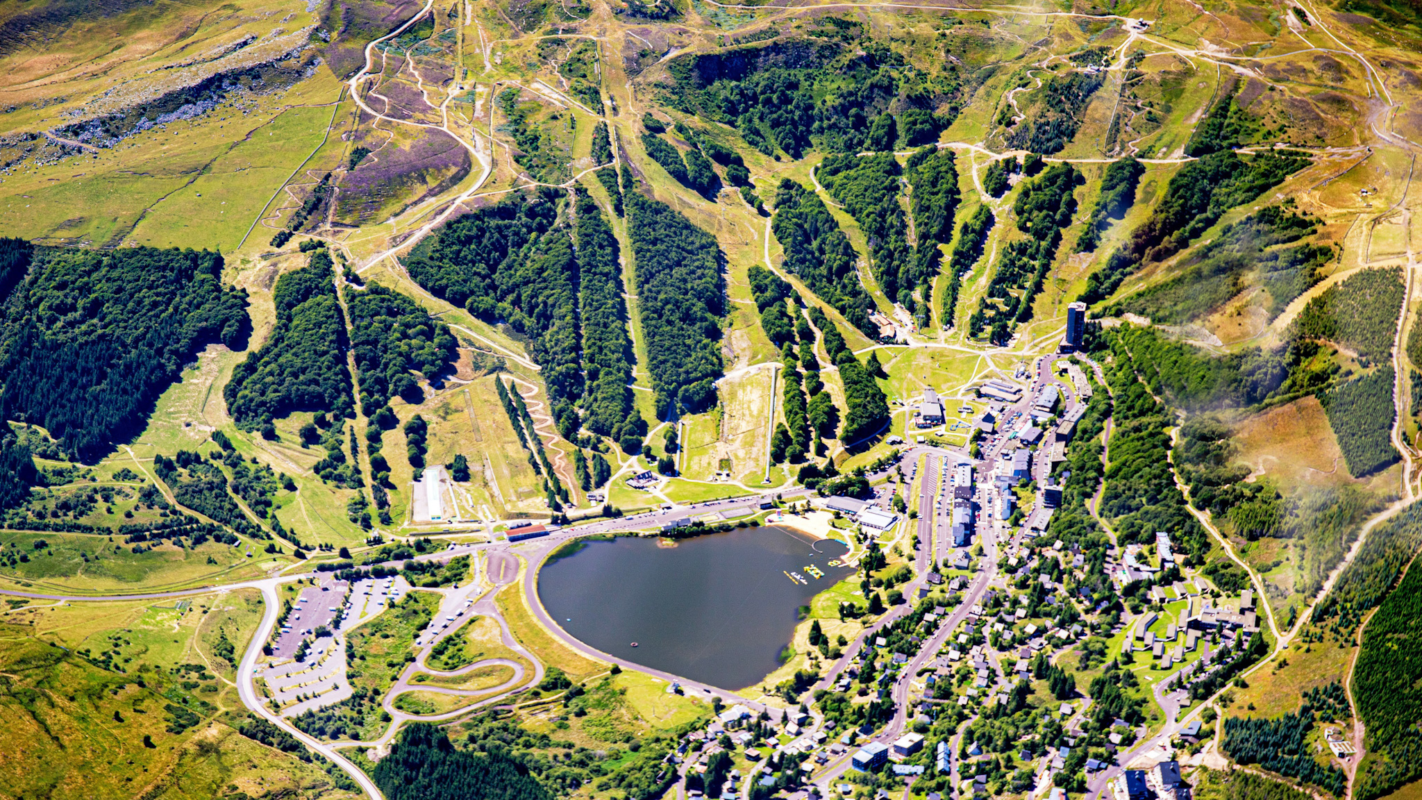 Aerial view of the resort of Super Besse, Lac des Hermines and the center of the resort