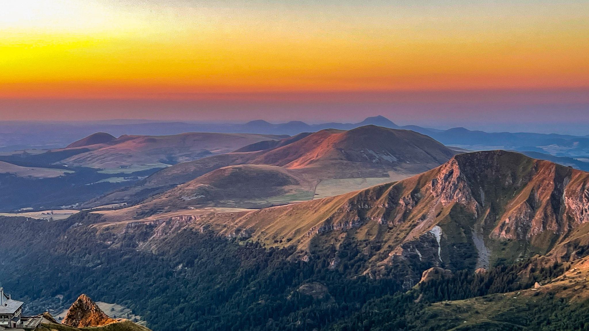 Sunset from Puy Gris to Roc de Cuzeau and view of the Chaîne des Puys