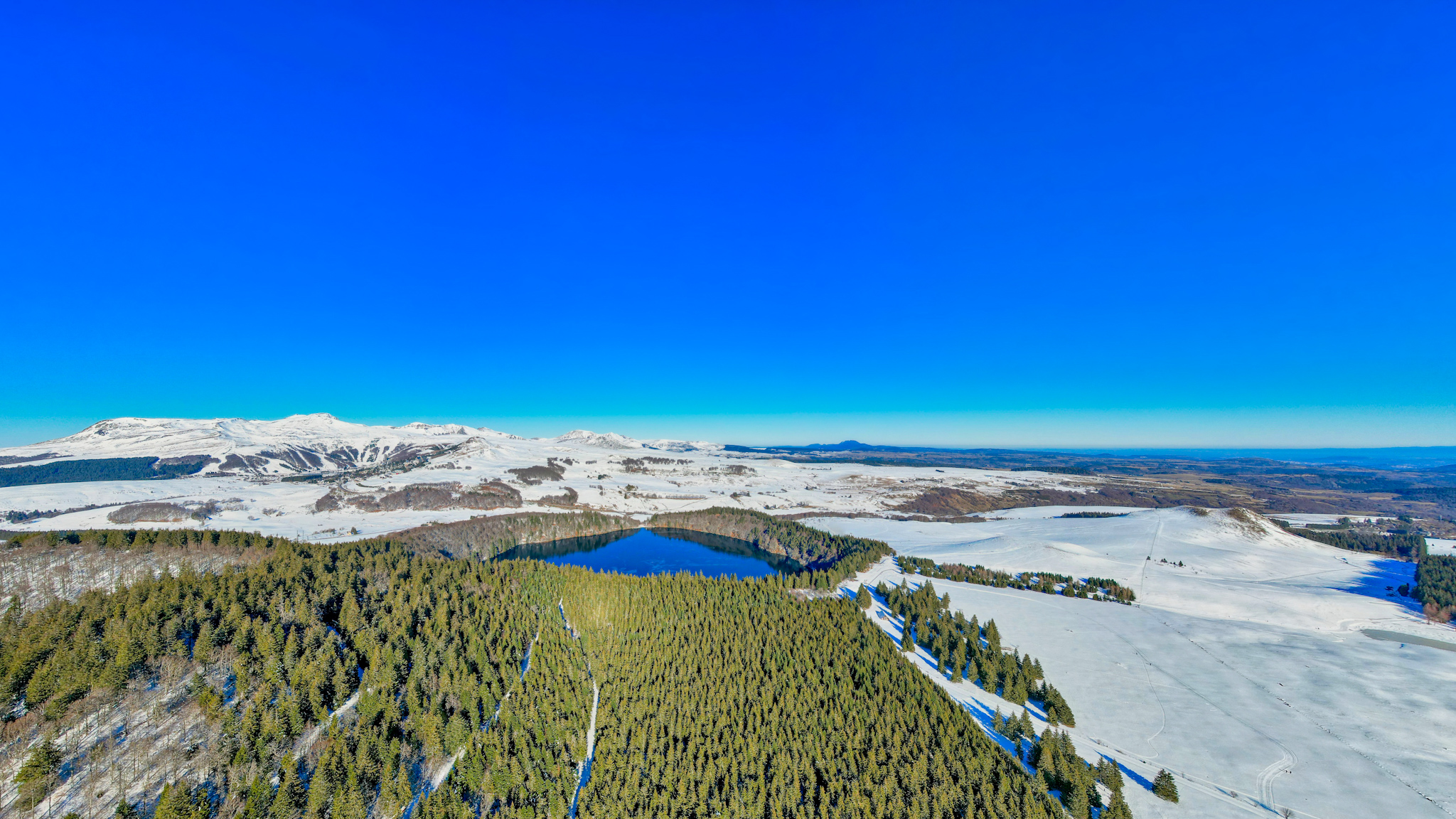 Above Lac Pavin, view. on the Massif du Sancy and the winter sports resort of Super Besse