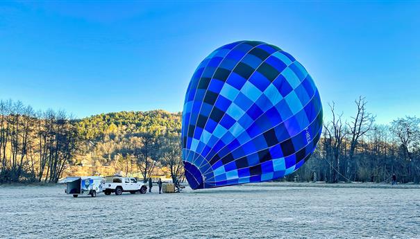 Hot air balloon over Lac Chambon, Murol