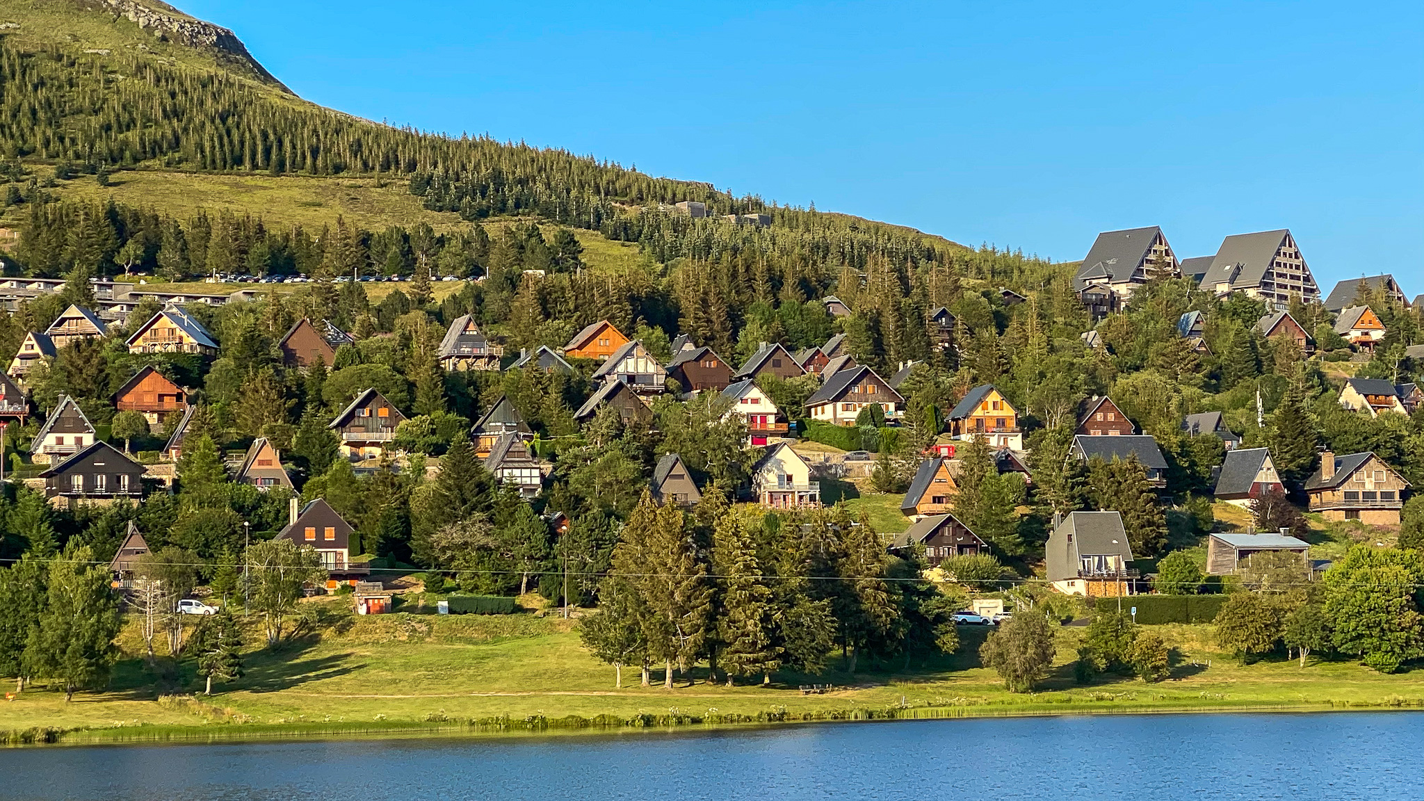 July, the chalet village in Super Besse on the shores of Lac des Hermines
